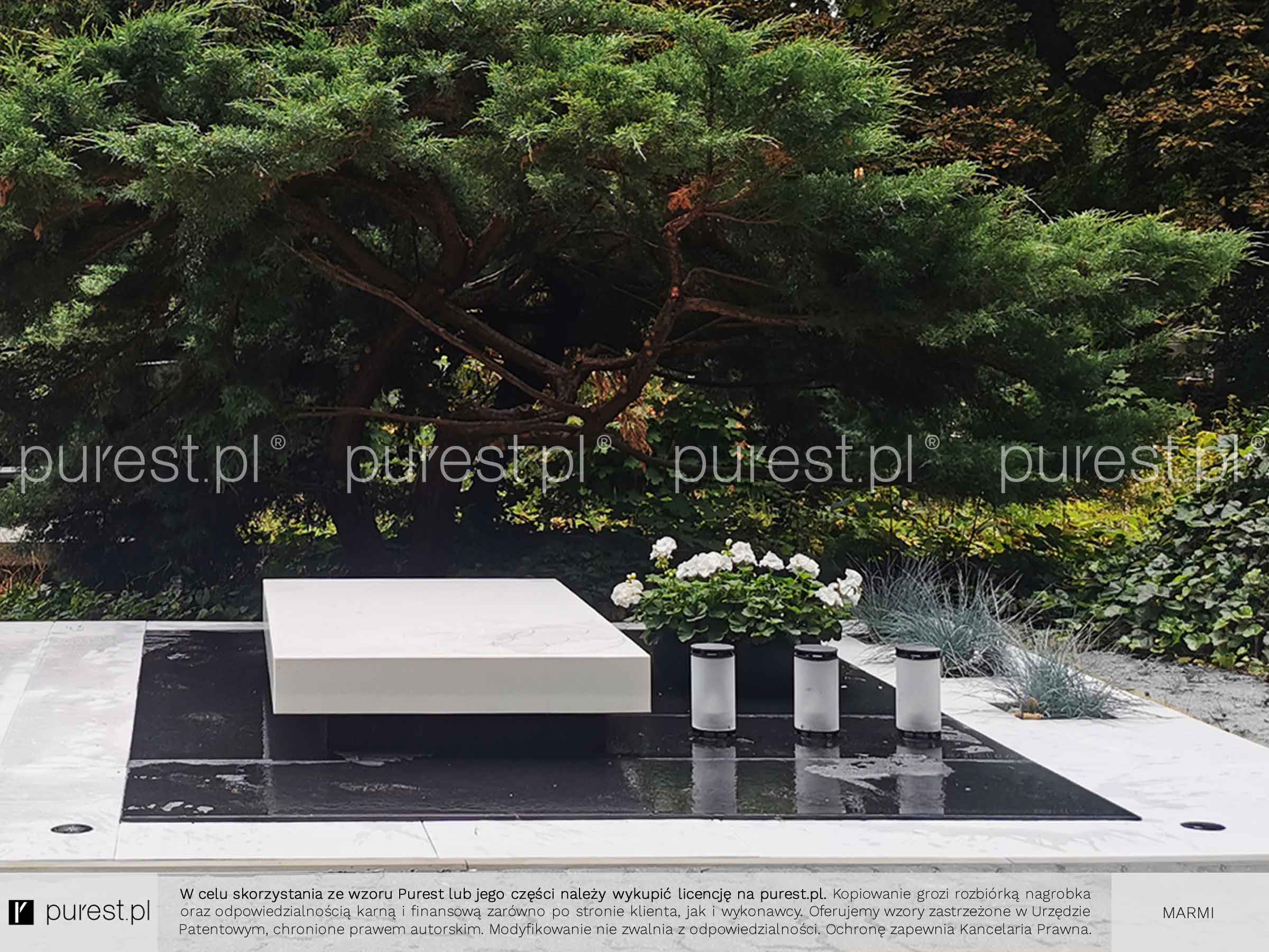 ładne groby z lampionami cmentarnymi