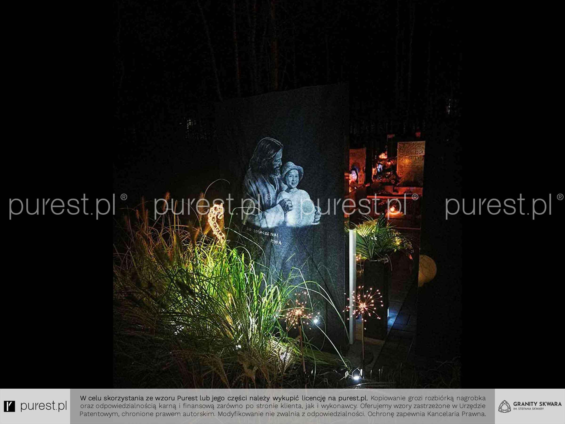 oświetlenie nagrobka z artystycznym rysunkiem